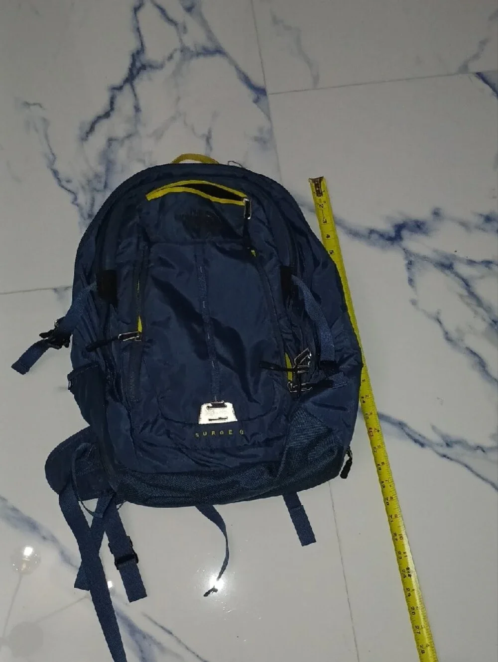 The North Face Navy Blue Backpack with Yellow Accents